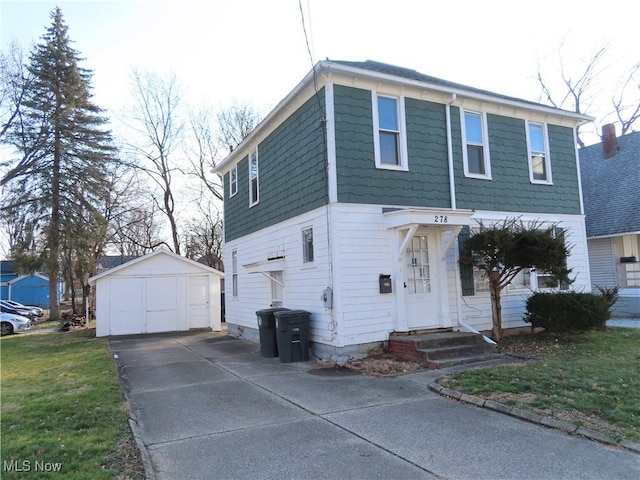 278 Wheeler St, Akron, OH 44304 - view of front of house with an outdoor structure, a garage, concrete driveway, and a front lawn