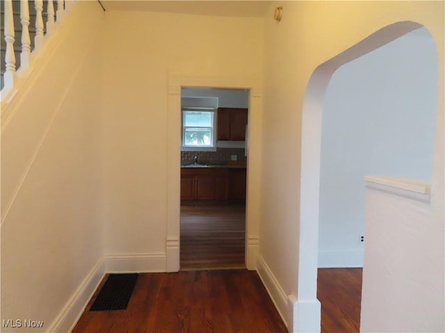 278 Wheeler St, Akron, OH 44304 - hall featuring arched walkways and dark wood-type flooring