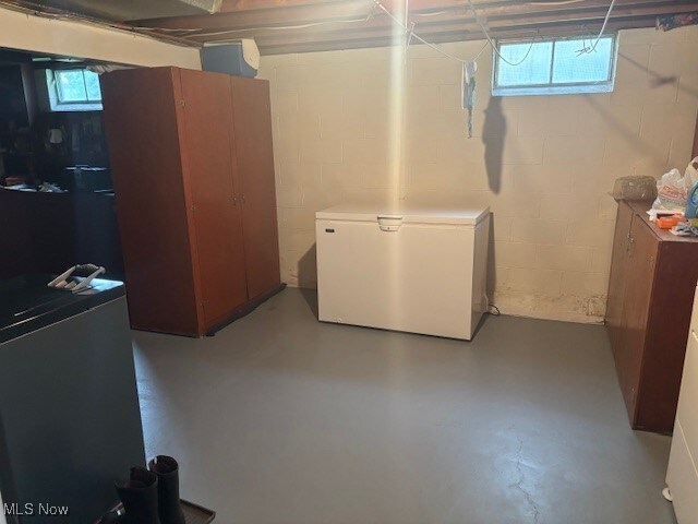 1527 Difford, Niles, OH 44446 - below grade area with refrigerator, concrete block wall, and plenty of natural light