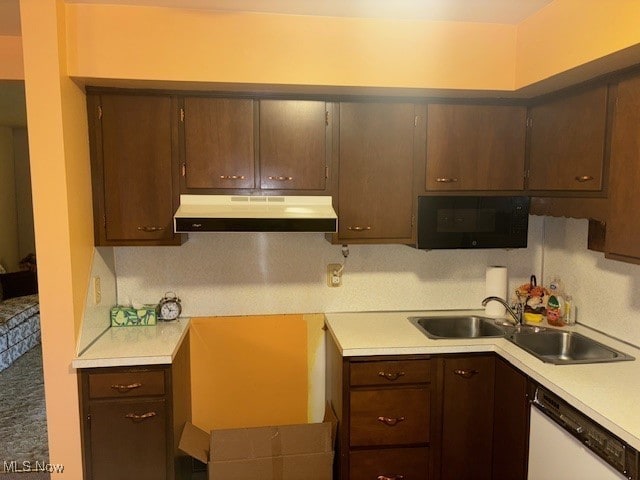 1527 Difford, Niles, OH 44446 - kitchen with range hood, dishwasher, black microwave, light countertops, and dark brown cabinetry