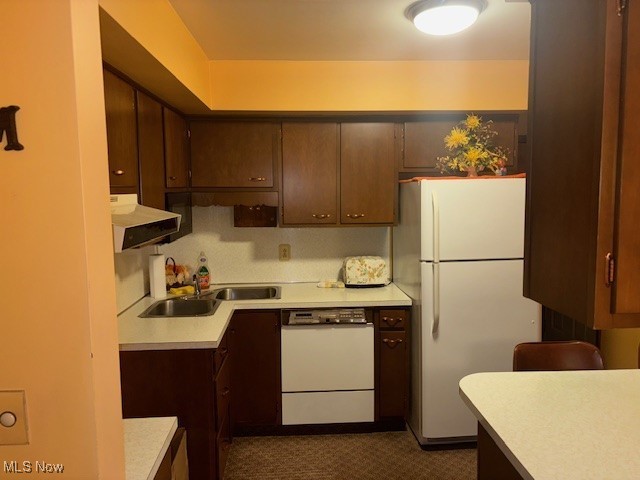 1527 Difford, Niles, OH 44446 - kitchen with white appliances, extractor fan, light countertops, and dark brown cabinetry