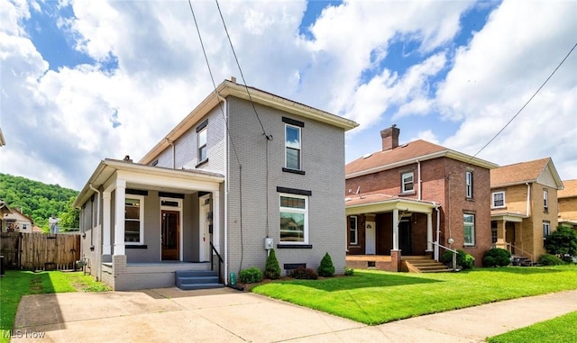 719 N 3rd St, Toronto, OH 43964 - view of front facade with covered porch and brick siding