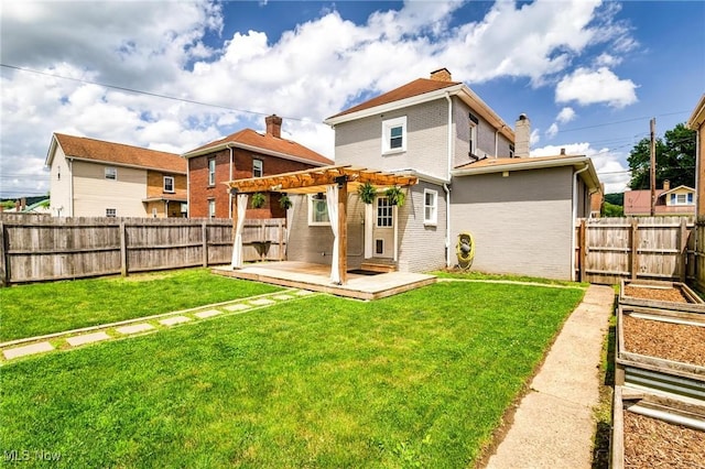 719 N 3rd St, Toronto, OH 43964 - back of property with a vegetable garden, a pergola, a fenced backyard, and brick siding