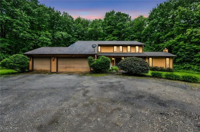 12938 Carter Rd, Leroy, OH 44077 - view of front of property with a garage, a chimney, and driveway
