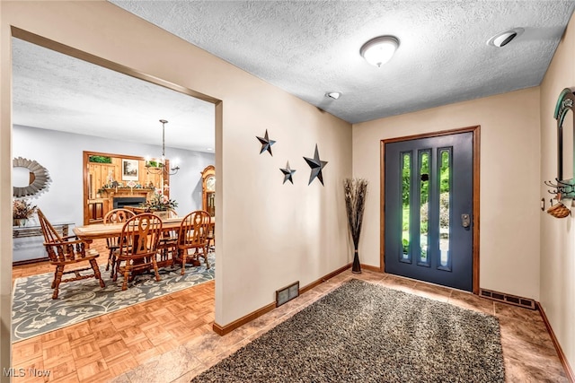 12938 Carter Rd, Leroy, OH 44077 - foyer featuring a textured ceiling and baseboards