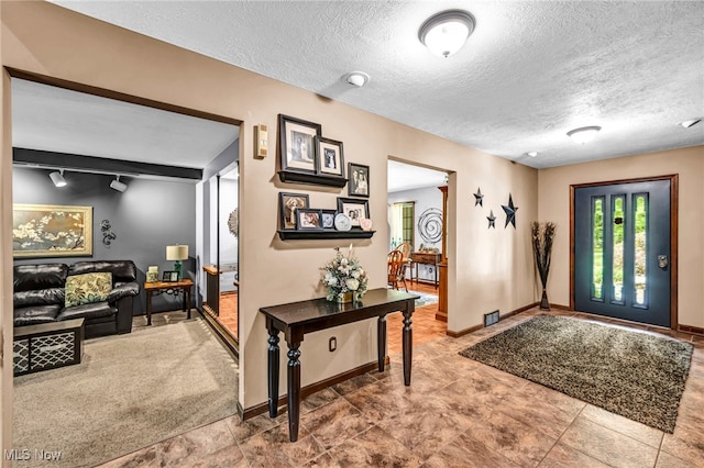 12938 Carter Rd, Leroy, OH 44077 - entrance foyer featuring a textured ceiling and baseboards