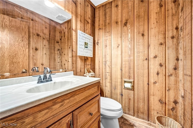 12938 Carter Rd, Leroy, OH 44077 - bathroom featuring vanity and wooden walls
