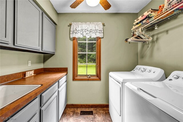 12938 Carter Rd, Leroy, OH 44077 - washroom featuring washing machine and dryer, cabinet space, and ceiling fan