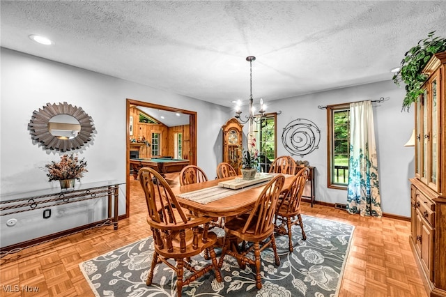 12938 Carter Rd, Leroy, OH 44077 - dining area with a chandelier, a textured ceiling, and recessed lighting
