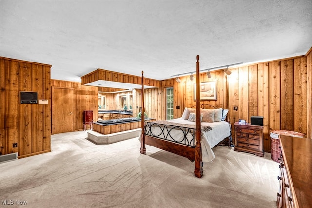 12938 Carter Rd, Leroy, OH 44077 - bedroom featuring wood walls, carpet floors, and a textured ceiling