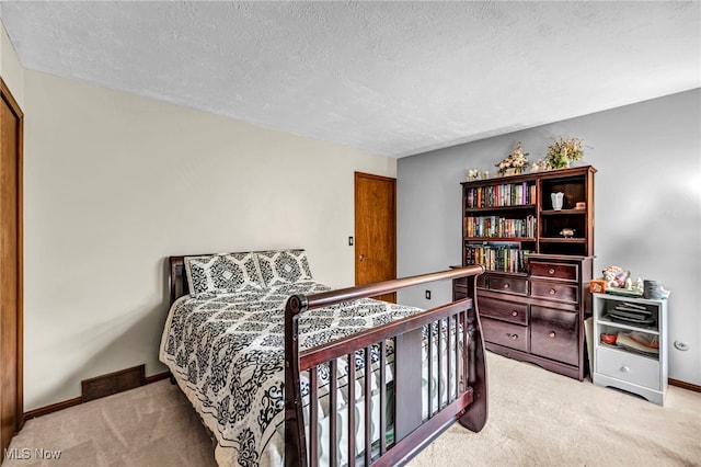 12938 Carter Rd, Leroy, OH 44077 - carpeted bedroom featuring a textured ceiling and baseboards
