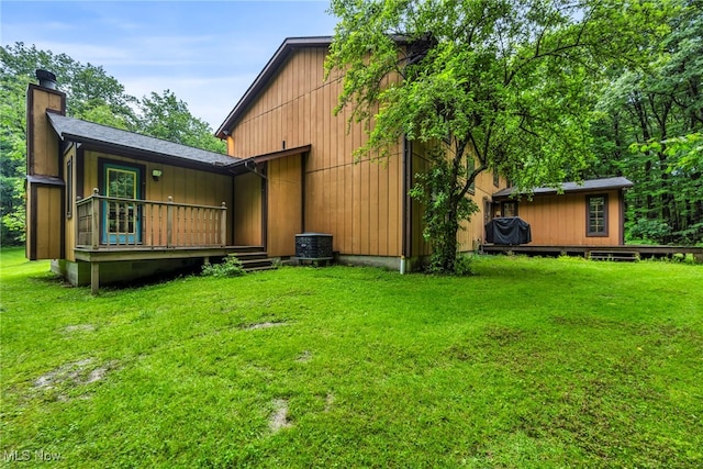 12938 Carter Rd, Leroy, OH 44077 - back of property featuring a chimney, a yard, and a deck