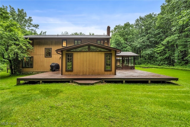 12938 Carter Rd, Leroy, OH 44077 - back of house featuring a deck and a yard