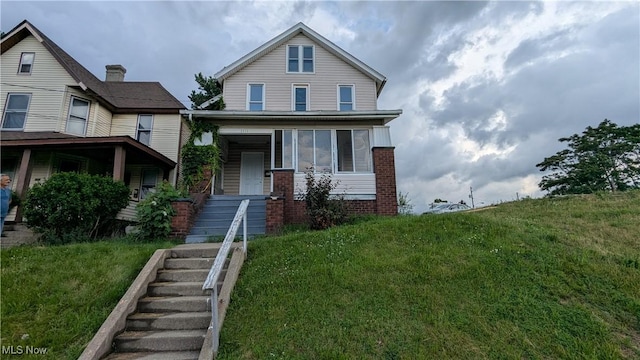 1111 2nd St NW, Canton, OH 44703 - view of front of property with brick siding and a front lawn