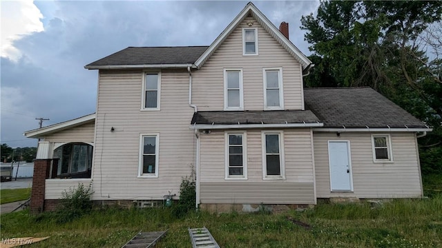 1111 2nd St NW, Canton, OH 44703 - rear view of property with roof with shingles and a chimney