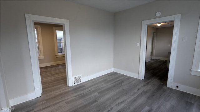 1111 2nd St NW, Canton, OH 44703 - spare room featuring dark wood-type flooring and a smoke detector