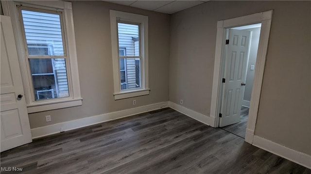 1111 2nd St NW, Canton, OH 44703 - unfurnished room with dark wood-style floors and baseboards