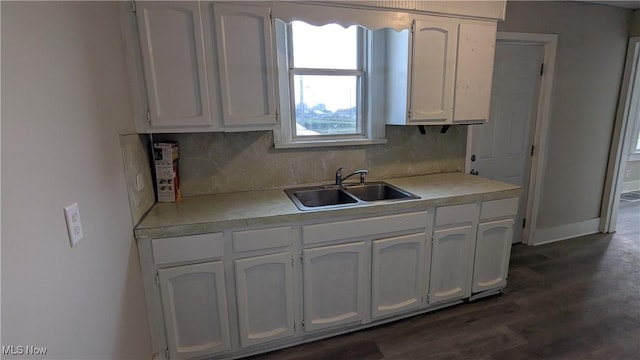 1111 2nd St NW, Canton, OH 44703 - kitchen featuring white cabinets, light countertops, tasteful backsplash, and dark wood finished floors