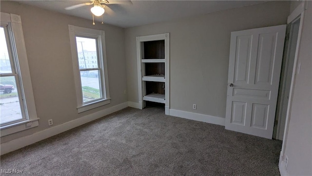 1111 2nd St NW, Canton, OH 44703 - unfurnished bedroom featuring carpet flooring and baseboards