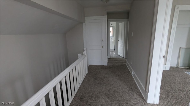 1111 2nd St NW, Canton, OH 44703 - hall with an upstairs landing, dark colored carpet, and lofted ceiling
