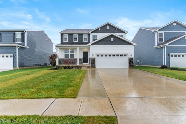23563 Rebecca Ln, Columbia Station, OH 44028 - craftsman-style house featuring concrete driveway, stone siding, a front yard, and an attached garage