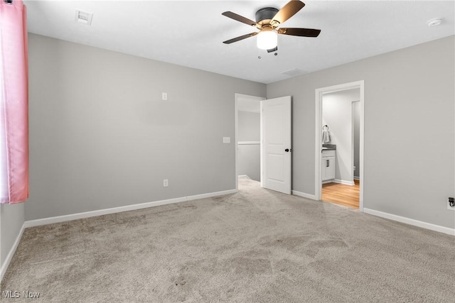 23563 Rebecca Ln, Columbia Station, OH 44028 - unfurnished bedroom with carpet flooring, connected bathroom, and a ceiling fan