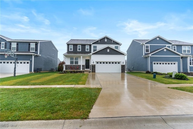 23563 Rebecca Ln, Columbia Station, OH 44028 - craftsman house featuring stone siding, concrete driveway, and a front lawn