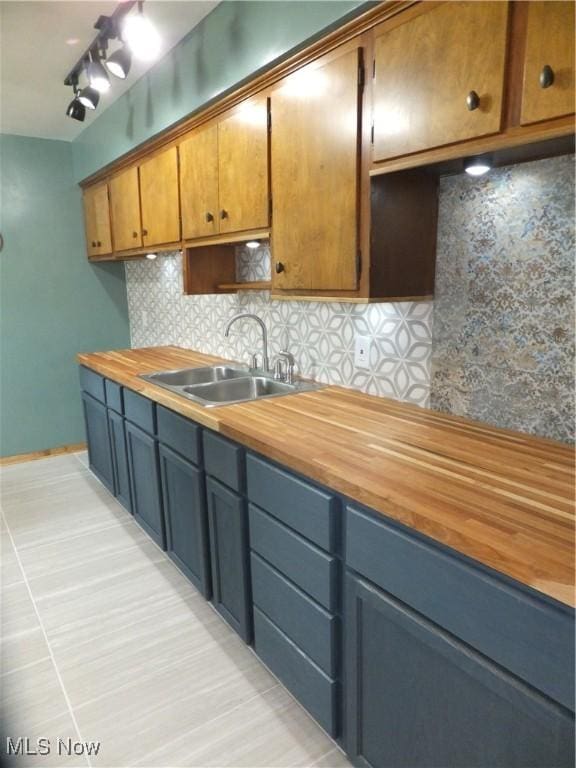 13621 Bellbrook Dr, Brook Park, OH 44142 - kitchen featuring tasteful backsplash and butcher block countertops