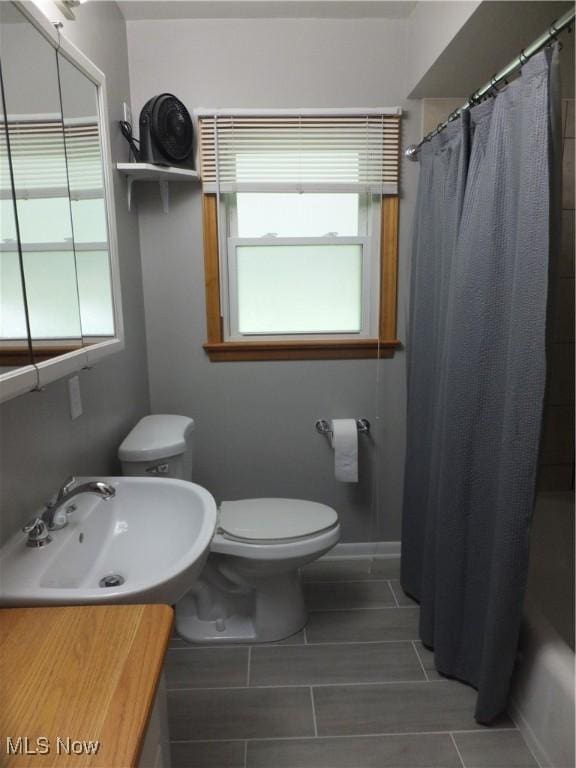 13621 Bellbrook Dr, Brook Park, OH 44142 - bathroom featuring vanity, tile patterned flooring, and shower / bath combo