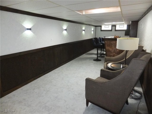13621 Bellbrook Dr, Brook Park, OH 44142 - sitting room with a drop ceiling, bar area, and a textured wall