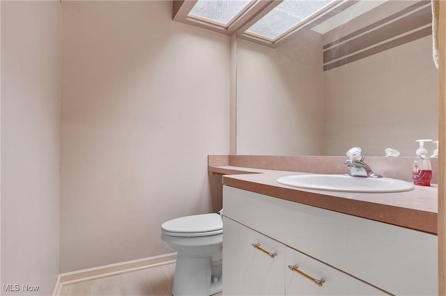 80 Hawthorne Ave, Rittman, OH 44270 - half bathroom with vanity and a skylight