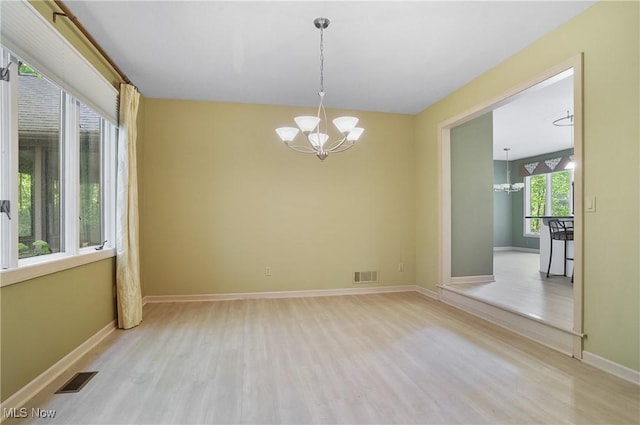 80 Hawthorne Ave, Rittman, OH 44270 - spare room with a chandelier and light wood finished floors