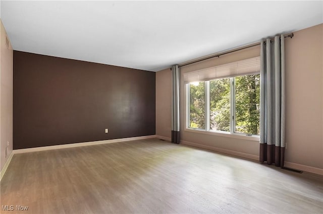 80 Hawthorne Ave, Rittman, OH 44270 - unfurnished room with light wood-style flooring and baseboards