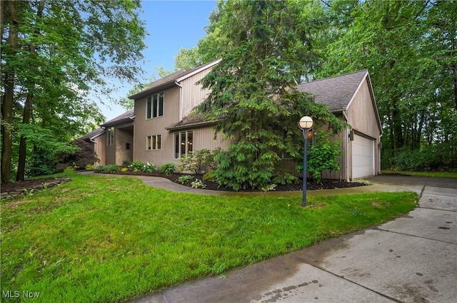 80 Hawthorne Ave, Rittman, OH 44270 - view of front of house with concrete driveway, a front yard, a garage, and roof with shingles