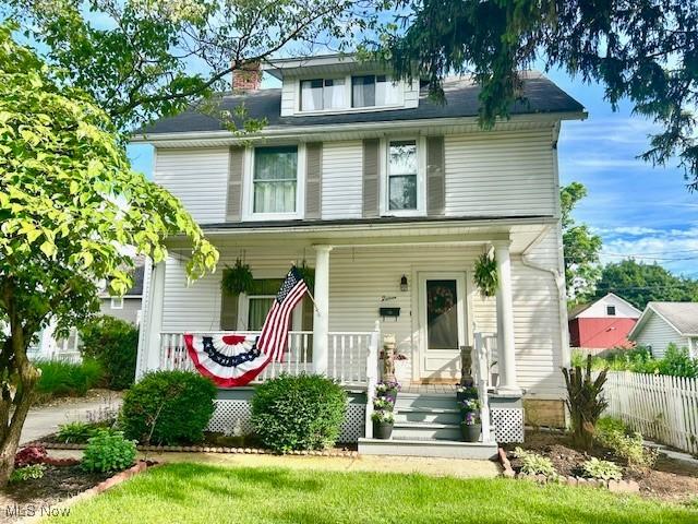 15 Charles St, Newark, OH 43055 - traditional style home featuring a porch and a chimney