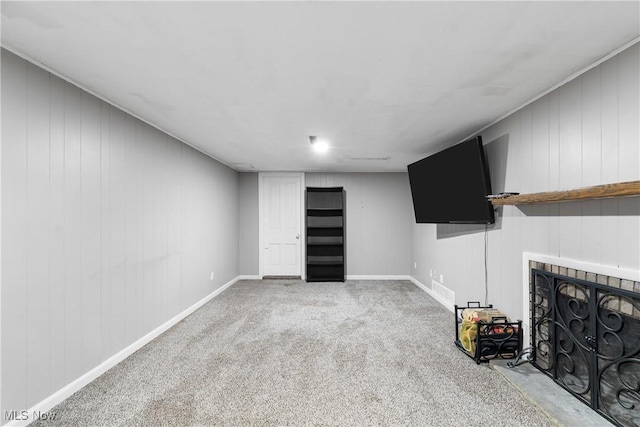8132 Arlington Ave NW, North Canton, OH 44720 - unfurnished living room featuring a fireplace with flush hearth and light carpet