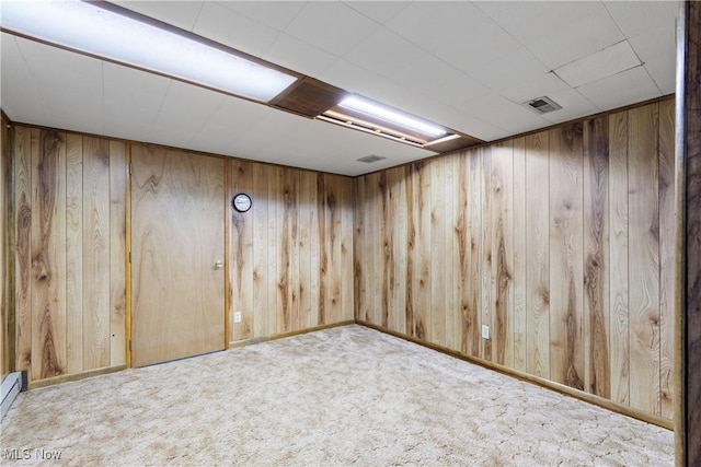 8132 Arlington Ave NW, North Canton, OH 44720 - finished basement with wooden walls, carpet, and baseboard heating
