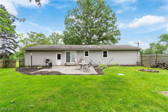 8132 Arlington Ave NW, North Canton, OH 44720 - rear view of property featuring a fenced backyard, a patio, and a chimney