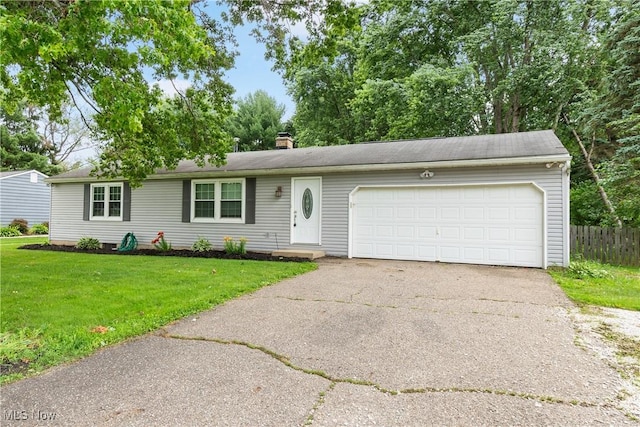 8132 Arlington Ave NW, North Canton, OH 44720 - view of front of home with a garage, asphalt driveway, and a chimney