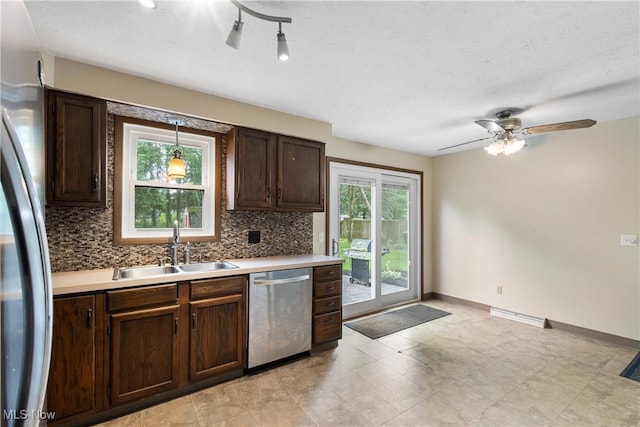 8132 Arlington Ave NW, North Canton, OH 44720 - kitchen featuring dishwasher, backsplash, fridge, dark brown cabinets, and light countertops