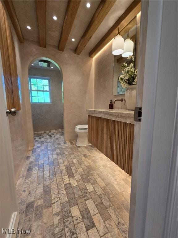 16535 Hosmer Rd, Middlefield, OH 44062 - bathroom featuring vanity, recessed lighting, beamed ceiling, brick flooring, and a shower