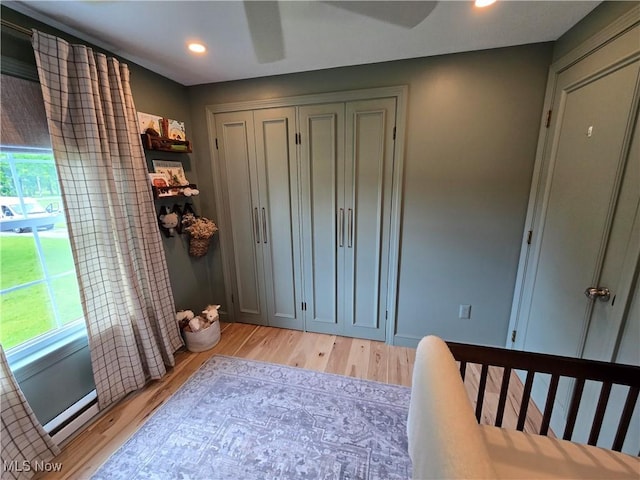 16535 Hosmer Rd, Middlefield, OH 44062 - bedroom with multiple windows, light wood-style flooring, recessed lighting, a ceiling fan, and a closet