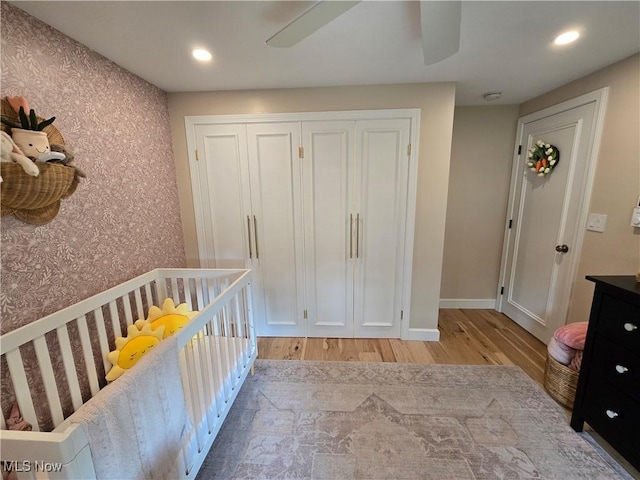 16535 Hosmer Rd, Middlefield, OH 44062 - bedroom featuring wallpapered walls, wood finished floors, a closet, recessed lighting, and a ceiling fan