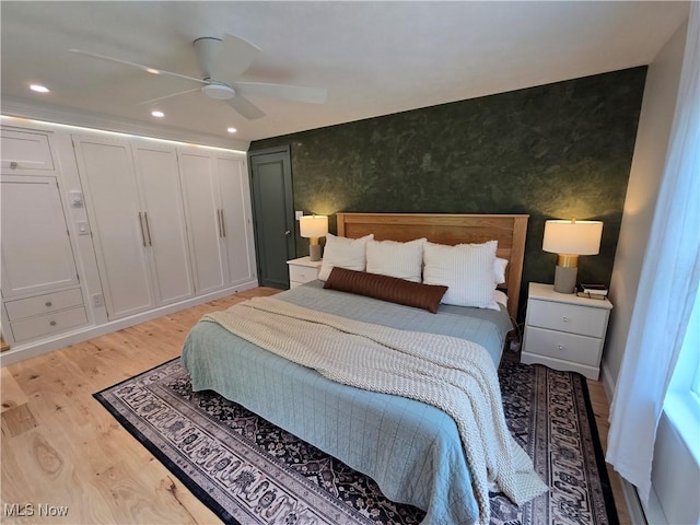 16535 Hosmer Rd, Middlefield, OH 44062 - bedroom with light wood-style floors, recessed lighting, a ceiling fan, and an accent wall
