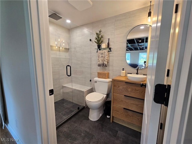 16535 Hosmer Rd, Middlefield, OH 44062 - bathroom with a shower stall, vanity, tile walls, and tile patterned floors