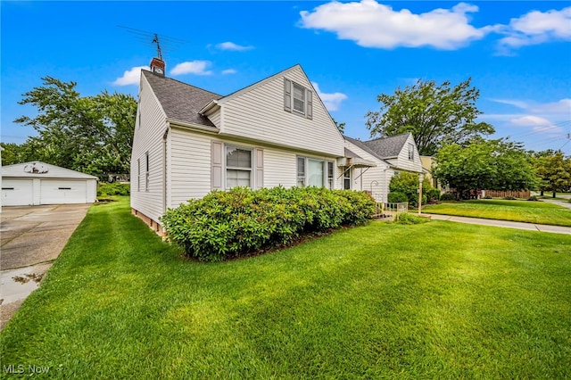 24270 Glenforest Rd, Euclid, OH 44123 - view of side of home with a garage, an outbuilding, a chimney, a yard, and roof with shingles