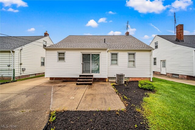 24270 Glenforest Rd, Euclid, OH 44123 - back of property featuring entry steps, a lawn, a patio area, and a shingled roof