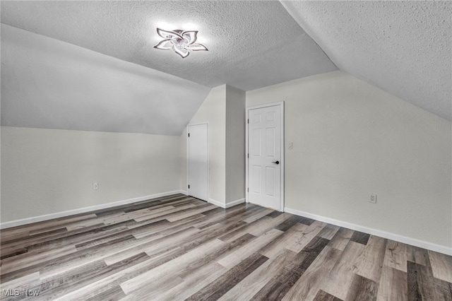 397 Furnace Rd, Conneaut, OH 44030 - bonus room featuring wood finished floors, a textured ceiling, and lofted ceiling