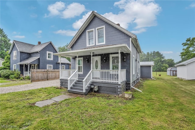397 Furnace Rd, Conneaut, OH 44030 - view of front of house featuring covered porch and gravel driveway