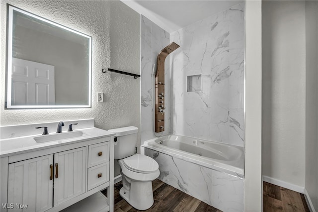 397 Furnace Rd, Conneaut, OH 44030 - full bathroom with a textured wall, wood finished floors, vanity, and a combined bath / shower with marble appearance